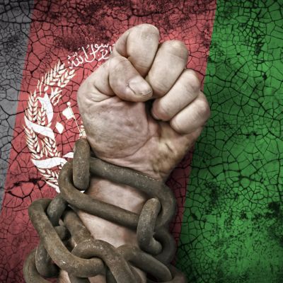 Independence: the hand, fist in chains and the flag of Afghanistan