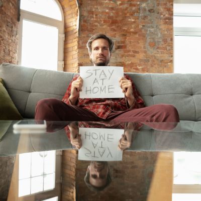 Caucasian man staying at home during quarantine because of coronavirus spreading