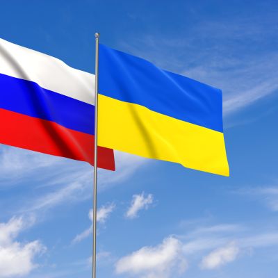 Russia and Ukraine flags over blue sky background. 3d Rendering